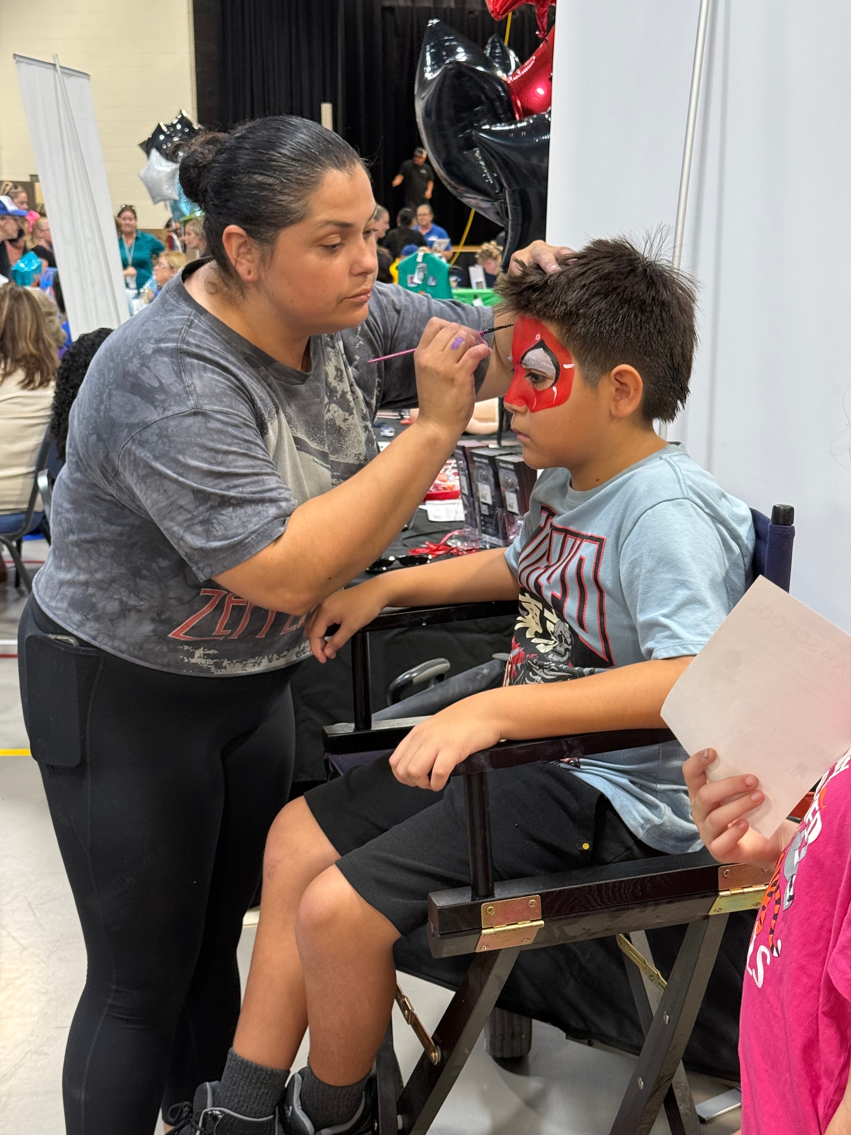 Face painting booth at the Back to School Health Fair
